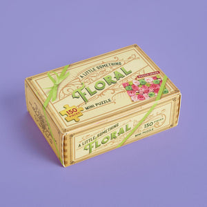 A Little Something Floral: 150-Piece Mini Puzzle box on purple background