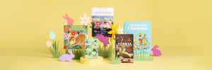 Group of spring-themes children's books with paper silhouettes of grass, flowers and bunnies