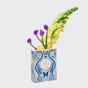 Bibliophile Ceramic Vase: Collected Curiosities with yellow and purple flowers