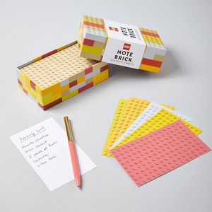 LEGO Note Brick (Yellow-Orange) with open box and fanned our note sheets