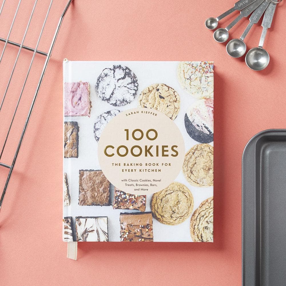 100 Cookies: The Baking Book for Every Kitchen with sheet pan, measuring spoons and cooling rack