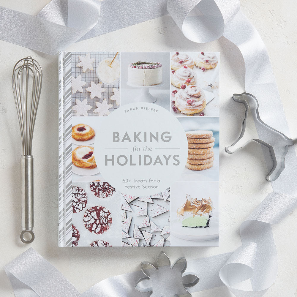 Baking for the Holidays with ribbons, cookie cutters and whisk