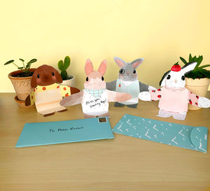 Snuggle Bunnies notecards on desk with envelopes