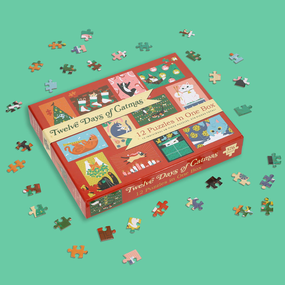 12 Puzzles in One Box: Twelve Days of Catmas box with puzzle pieces